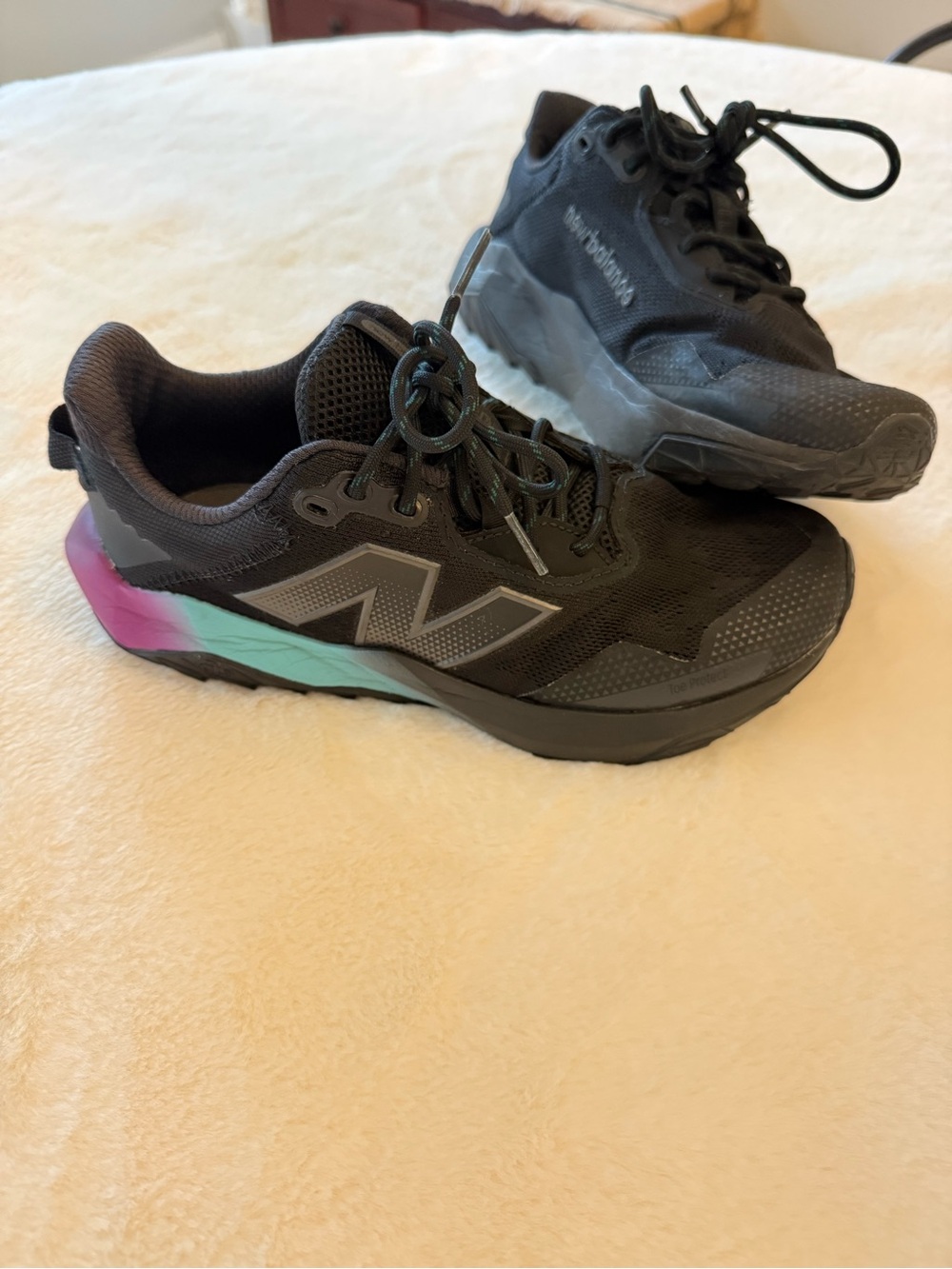 New Balance Women’s Black Trail Runners with Teal & Purple Heel Accents